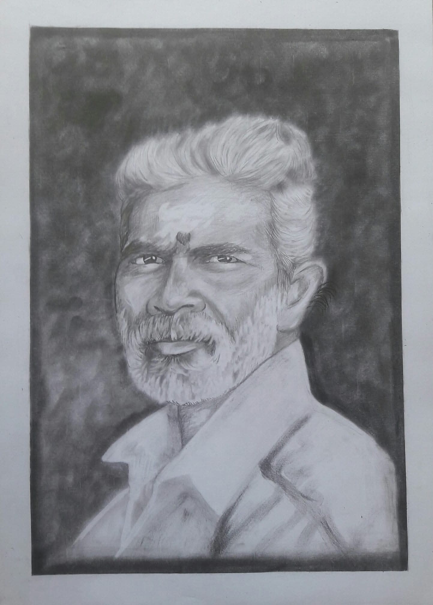 Man with white hair, beard and forehead markings in collared shirt