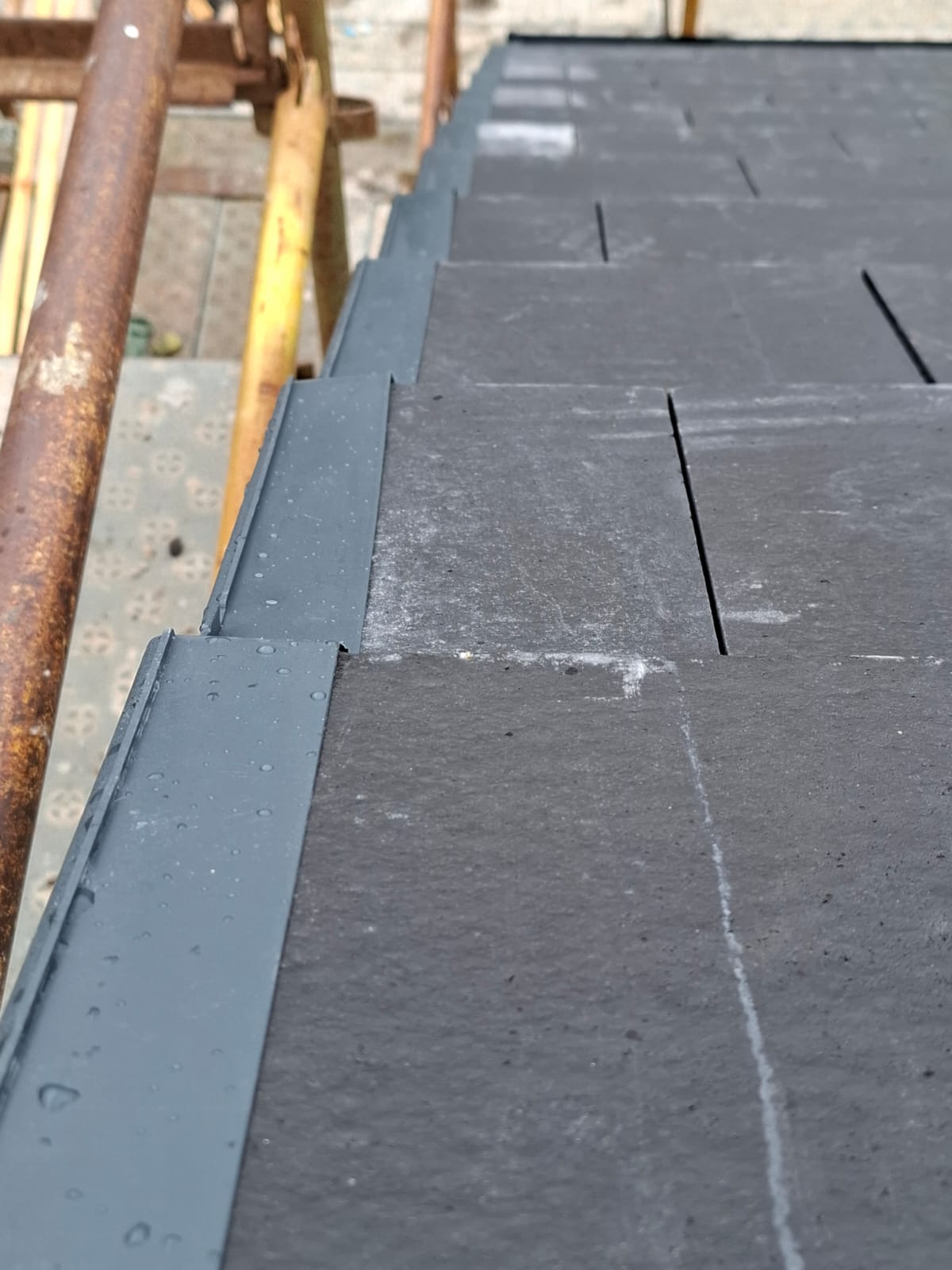 Precision dry verge edge system installation on modern slate roof by Smart Roofing Glasgow