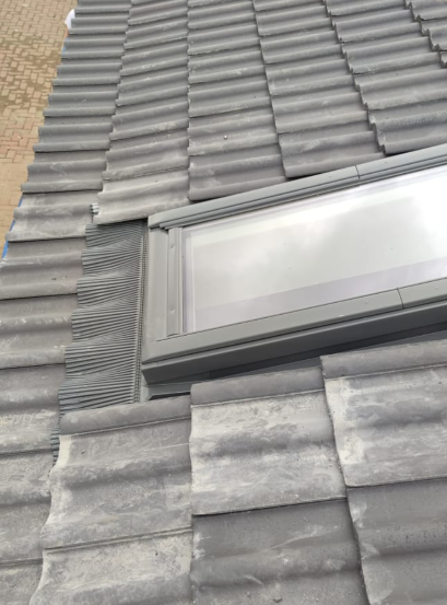 Close-up of profiled tile integration with corrugated Velux flashing kit by Smart Roofing Glasgow