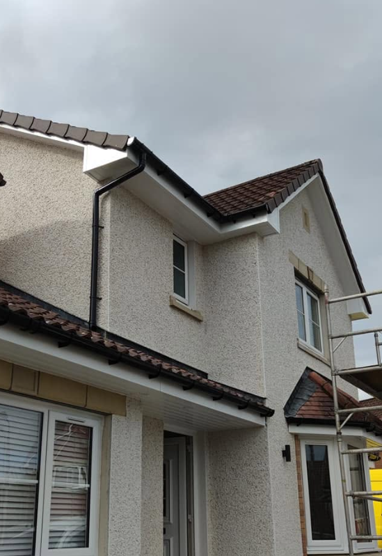 UPVC roofline fascias, soffits, and downpipe installation on two-storey home by Smart Roofing Glasgow