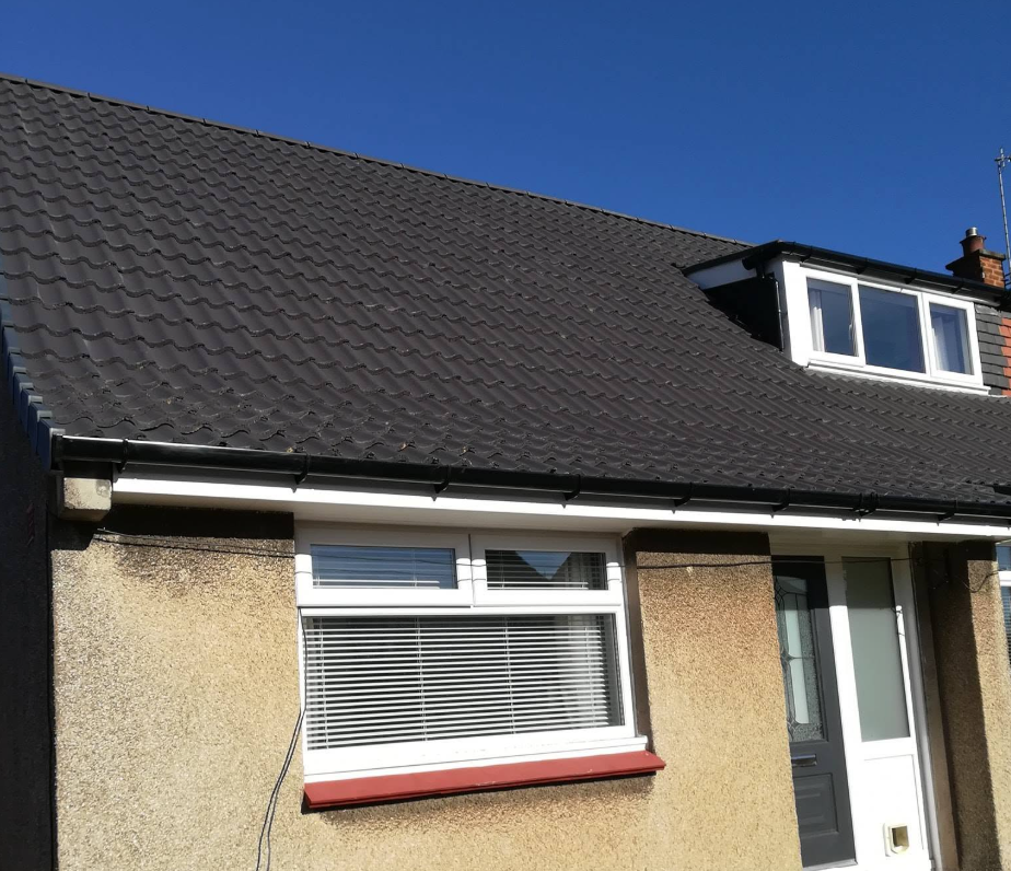 New dark profiled concrete roof tiles with dormer window detail by Smart Roofing Glasgow
