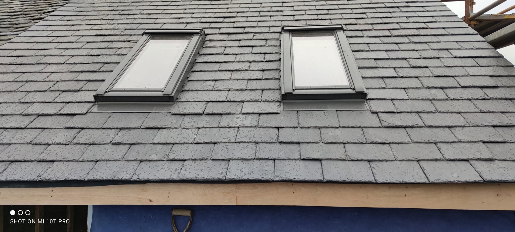 Slate roof installation with twin Velux windows by Smart Roofing Glasgow