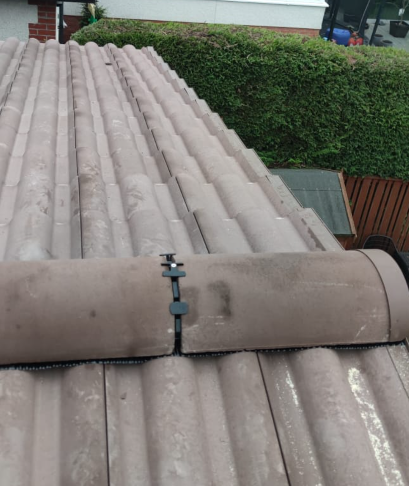 Dry ridge roll-out system with block end ridge cap detail by Smart Roofing Glasgow