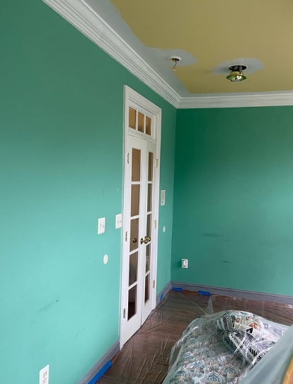 Emerald green interior wall painting with ceiling prep and protected floors
