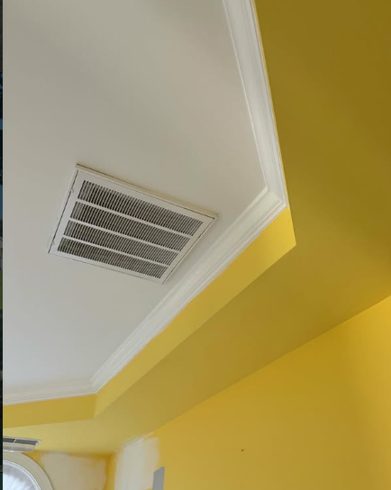 Sharp two-tone yellow and white ceiling cut-in and crown molding painting
