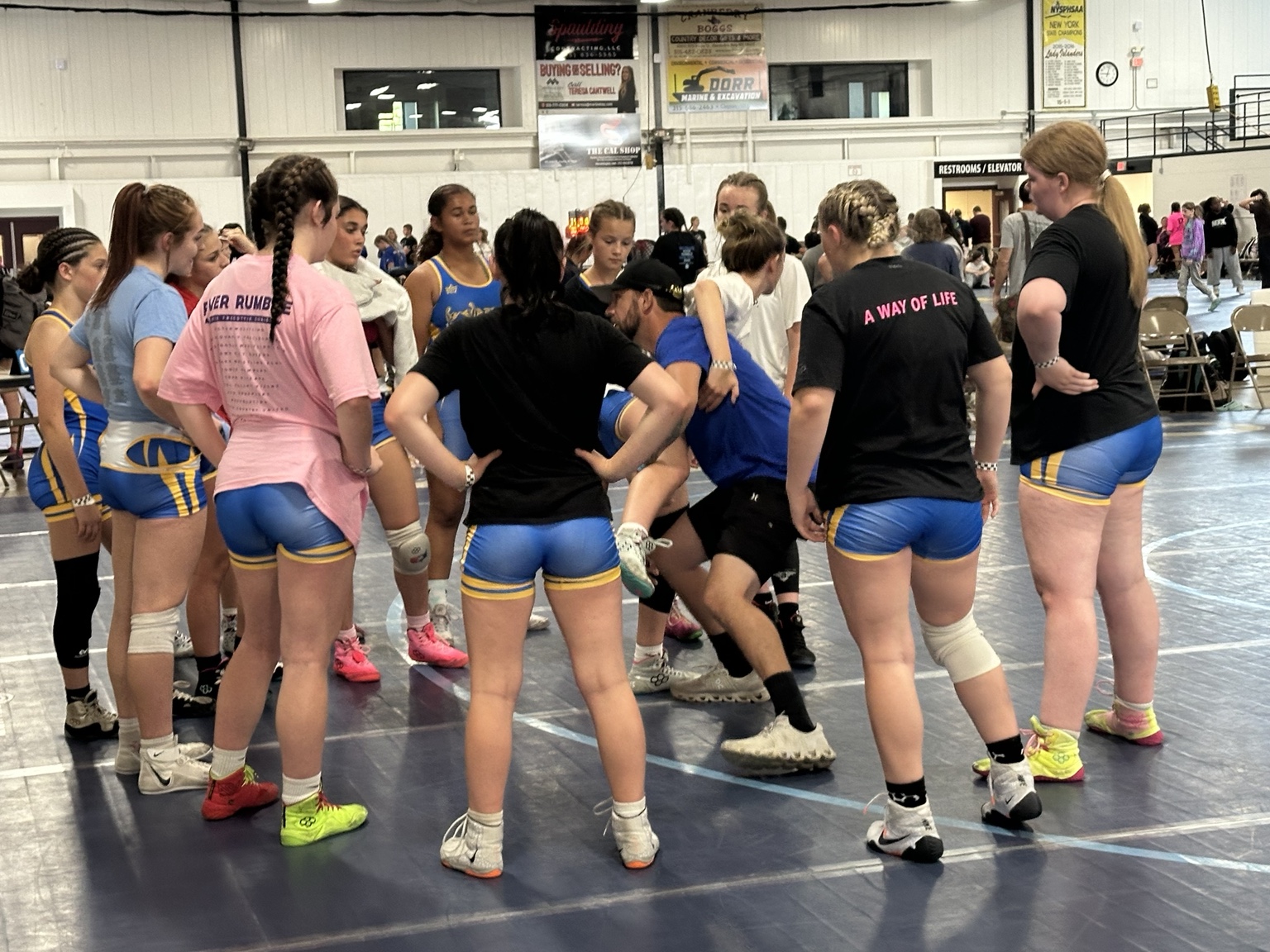 Warrior Warehouse Coach Working Directly With Wrestler