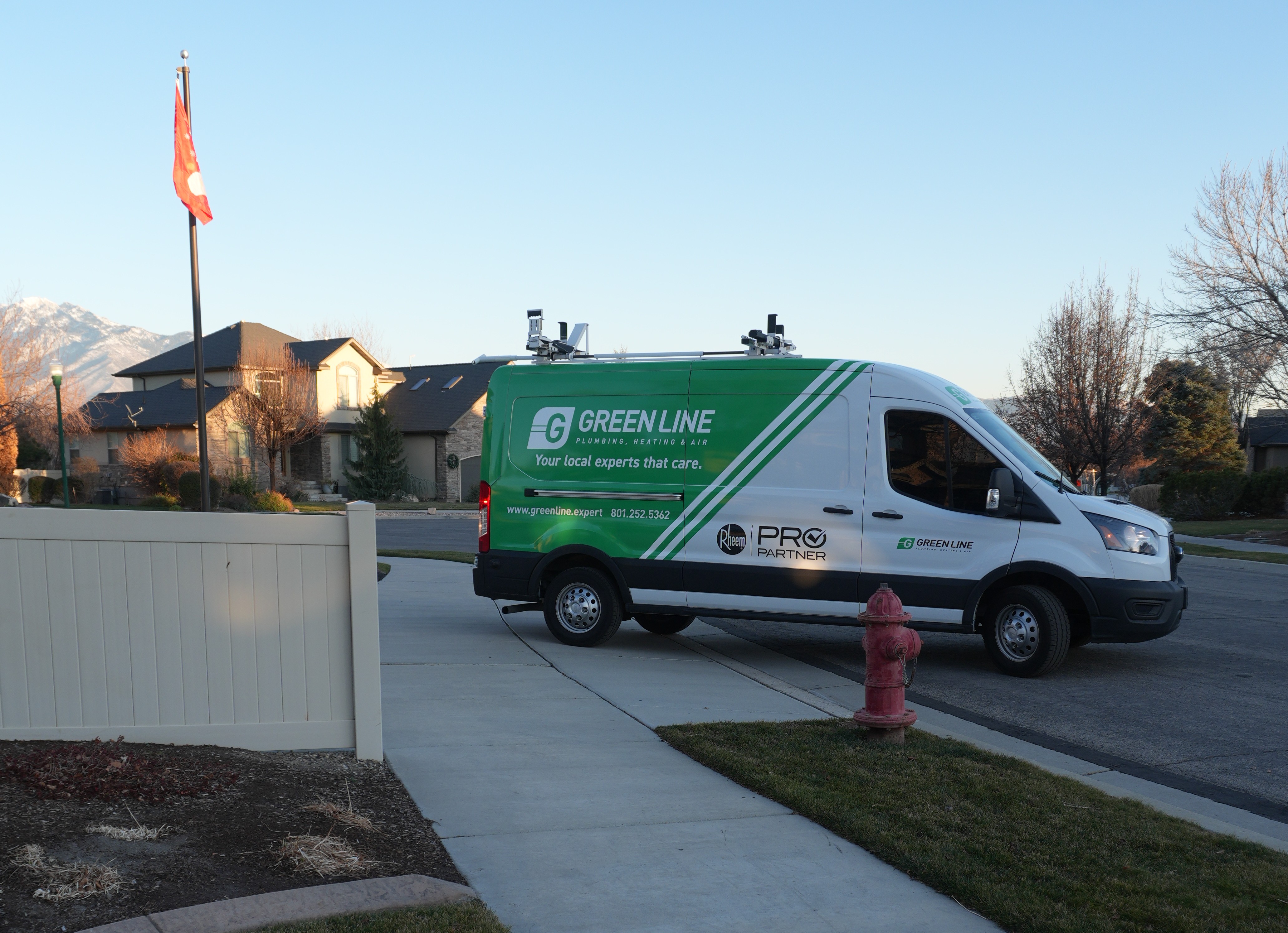 Green Line Plumbing, Heating & Air Rheem Pro Partner service vehicle parked on location in Utah