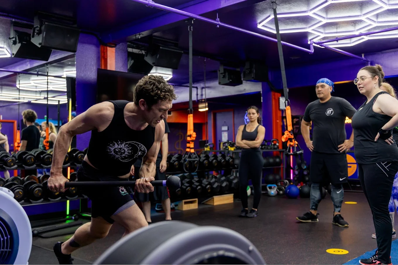 Coach guiding members during a semi-private training session at Spite Fitness