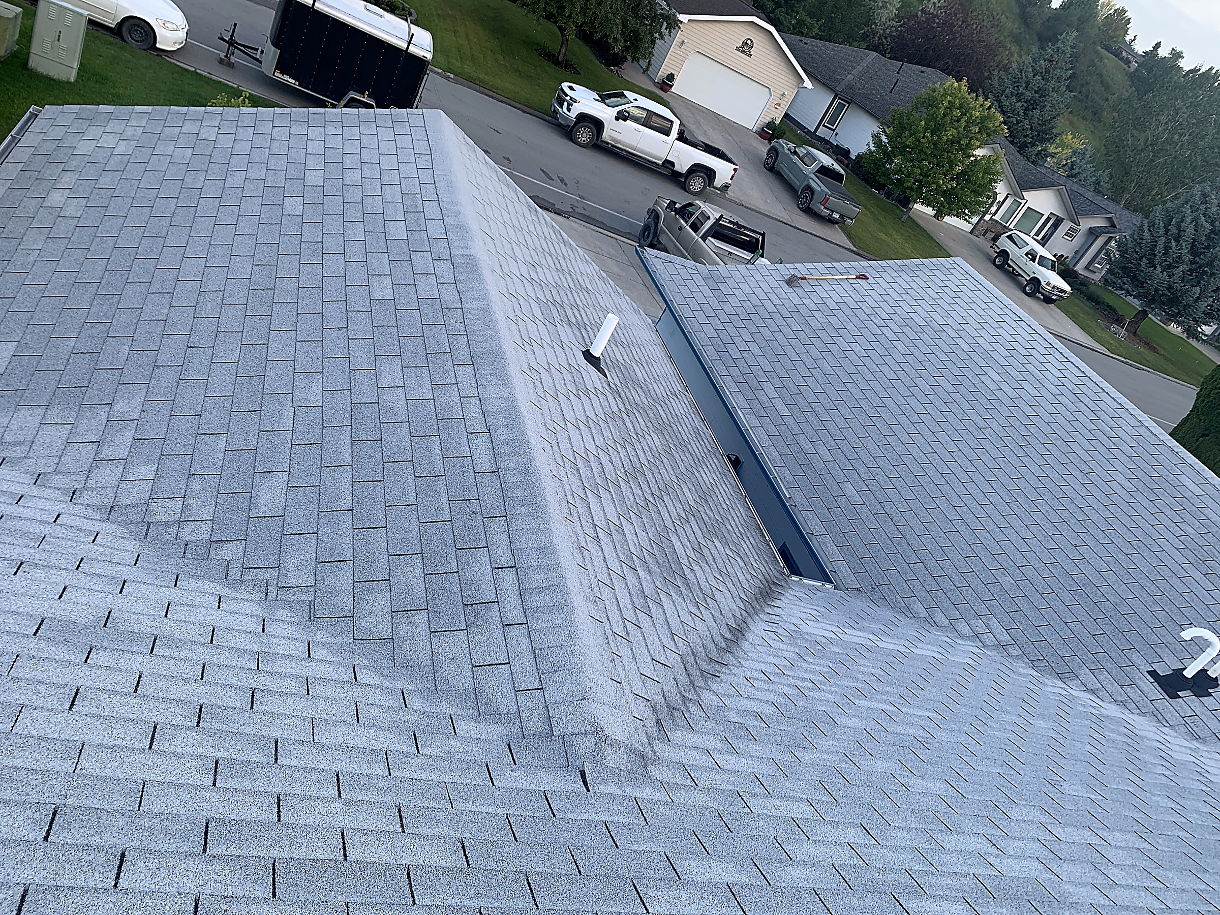 Asphalt shingle roof valley and ridge on a home in Kalispell, Montana