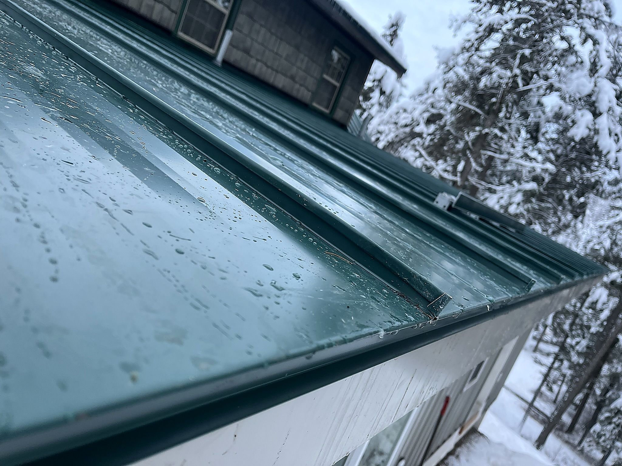 Metal roof edge detail in winter, Flathead Valley, Montana