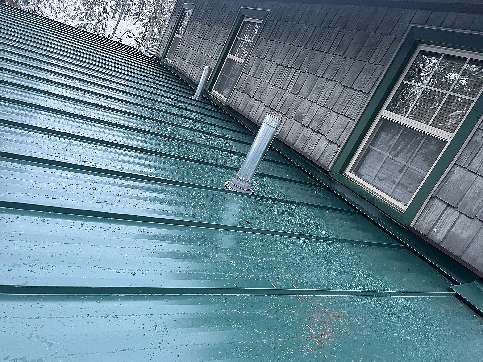 Green metal roof in winter, Flathead Valley, Montana