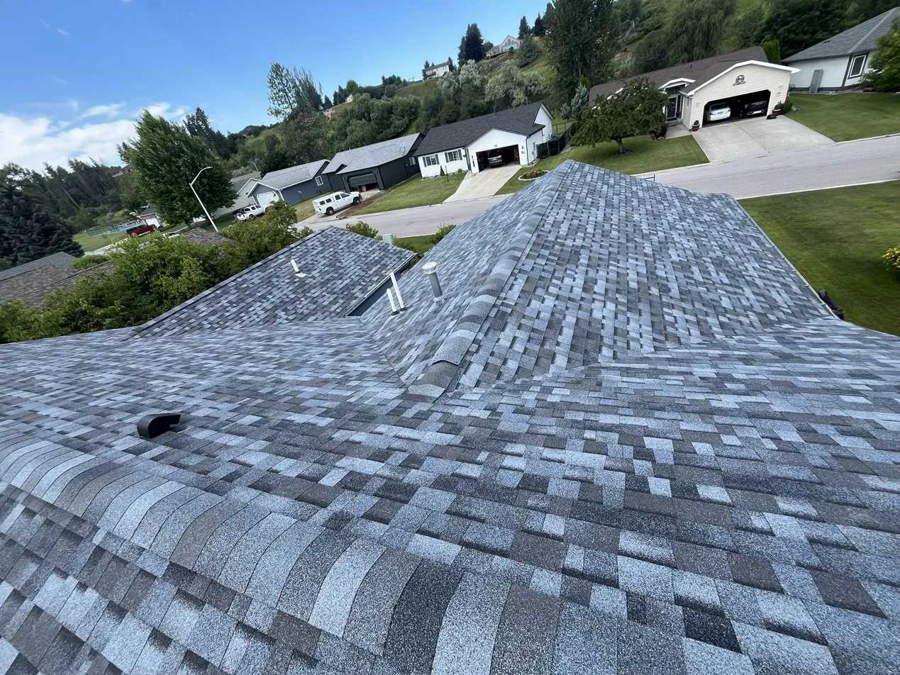 Completed asphalt shingle roof on a home in Kalispell, Montana
