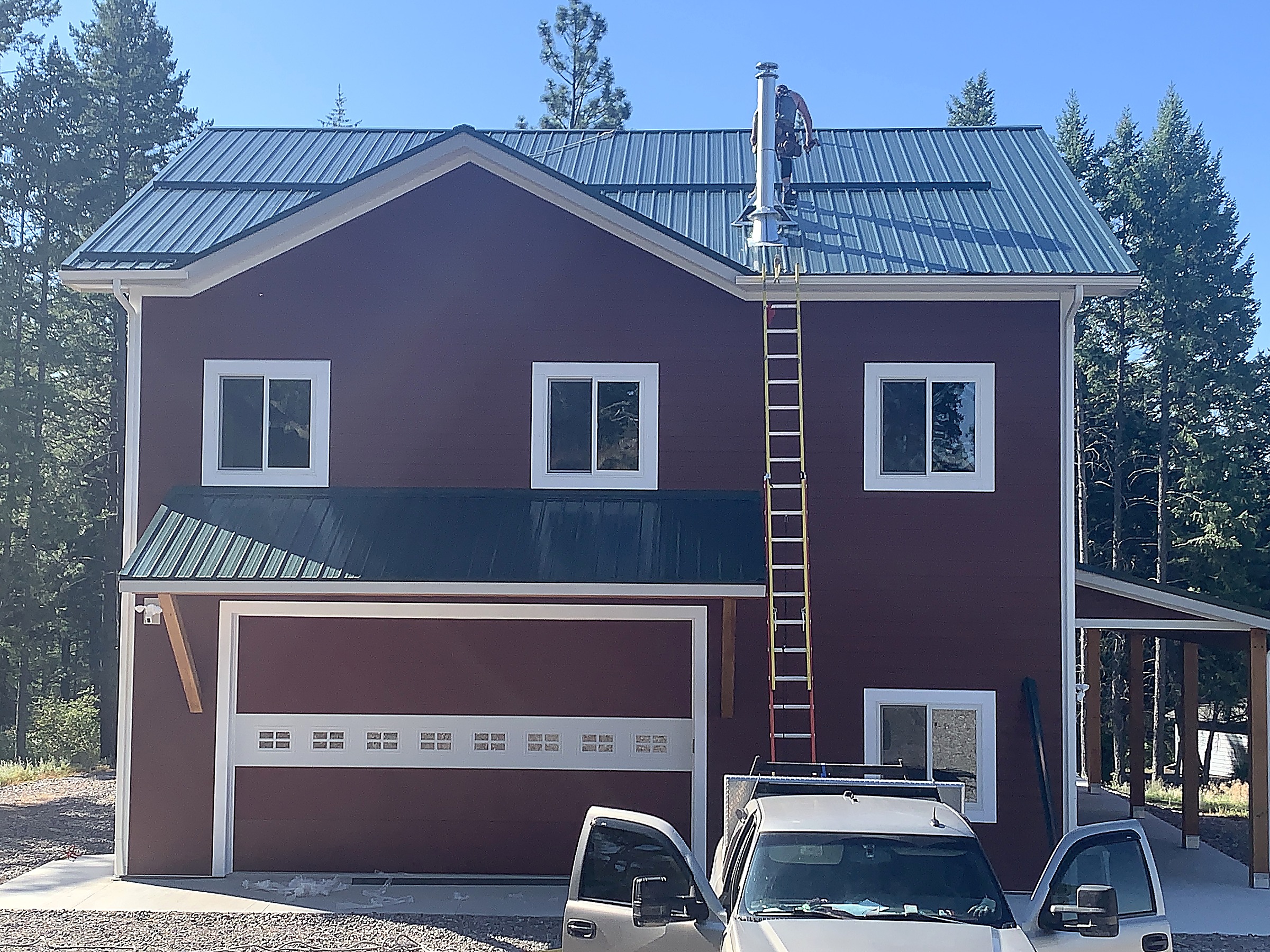 Green metal roof on a two-story home in the Flathead Valley, Montana