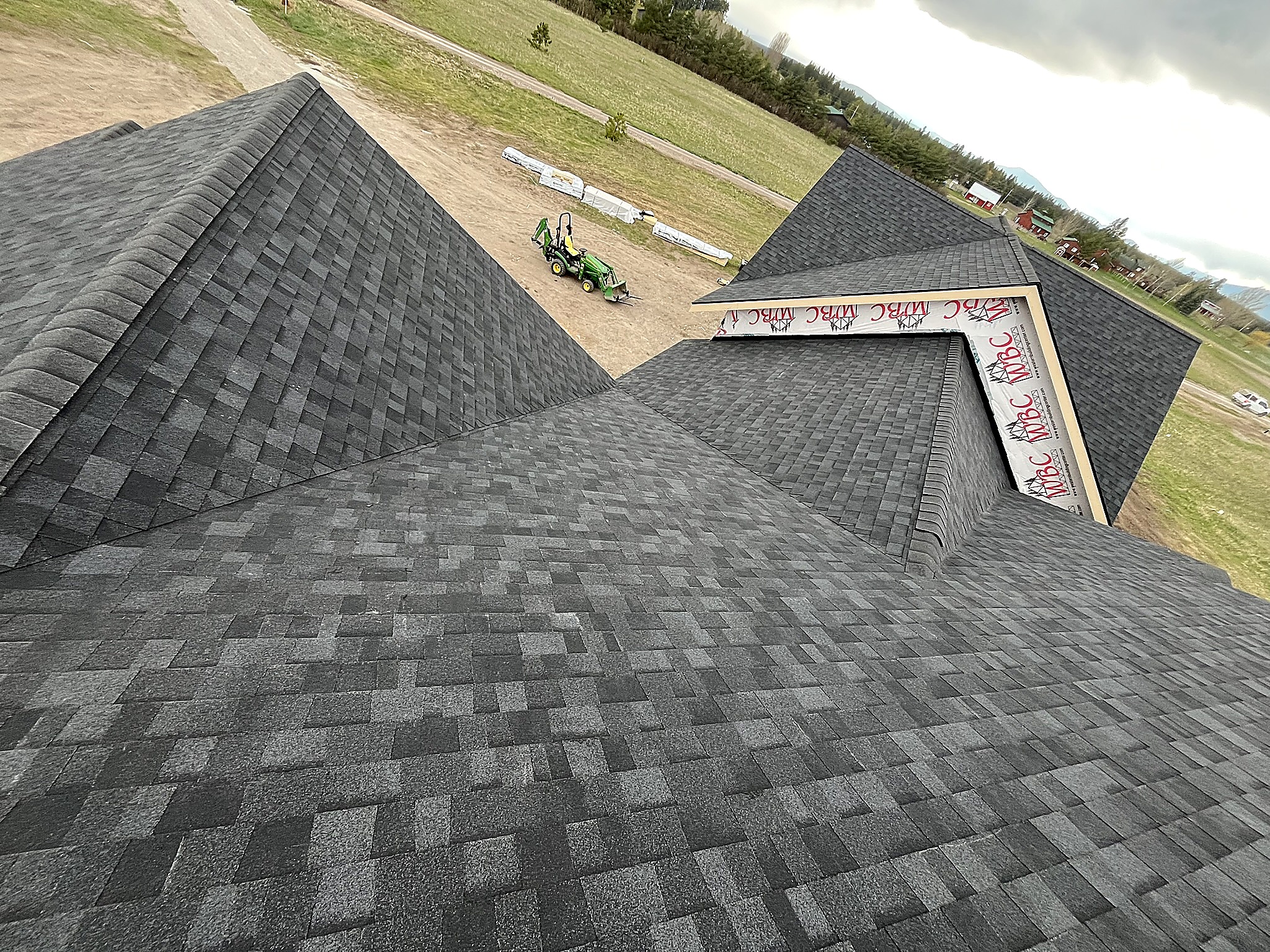 Overhead view of an asphalt shingle roof with hips and ridges, Flathead Valley, Montana