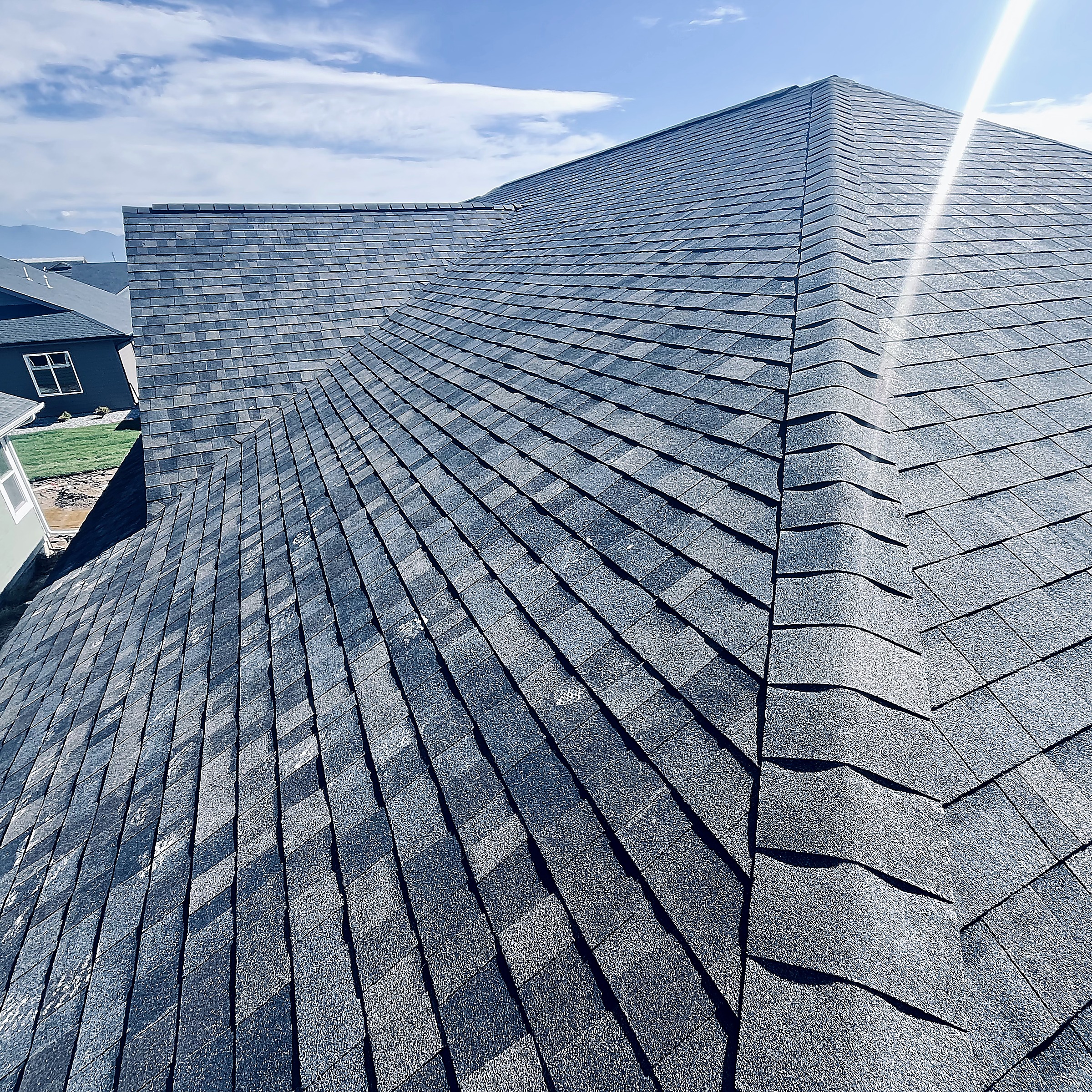 Asphalt shingle roof hip and ridge on a home in the Flathead Valley, Montana
