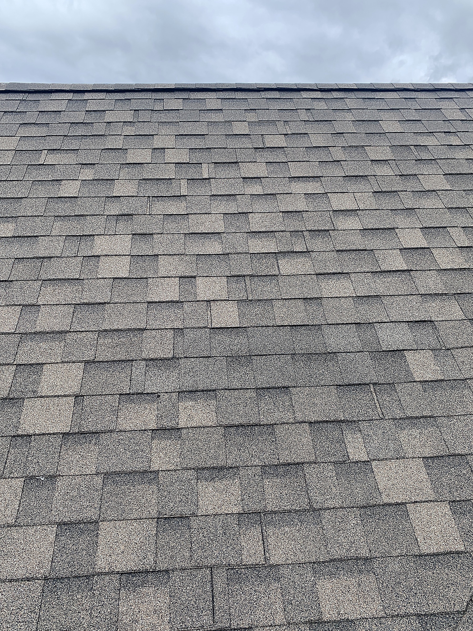 Close view of newly installed asphalt shingles, Flathead Valley, Montana