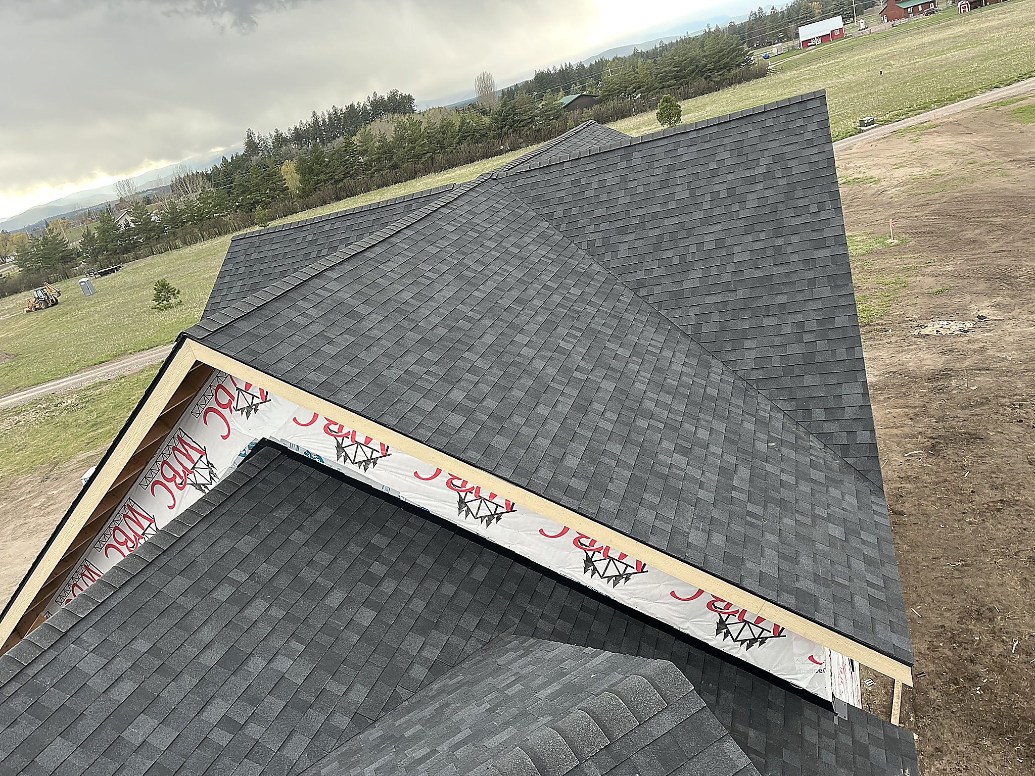 Asphalt shingle roof with multiple gables and valleys, Flathead Valley, Montana