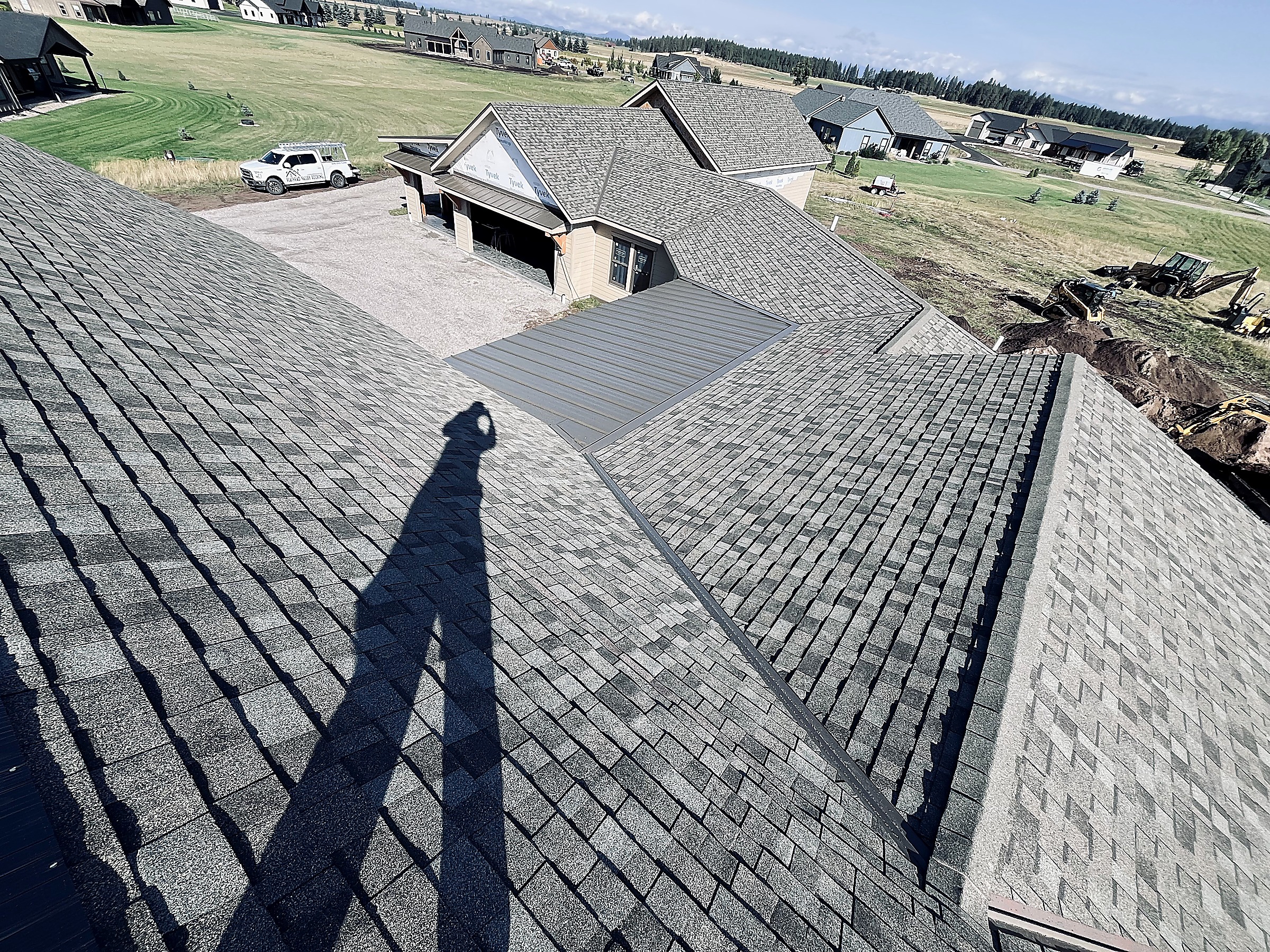 Asphalt shingle roof with a metal accent section, Flathead Valley, Montana