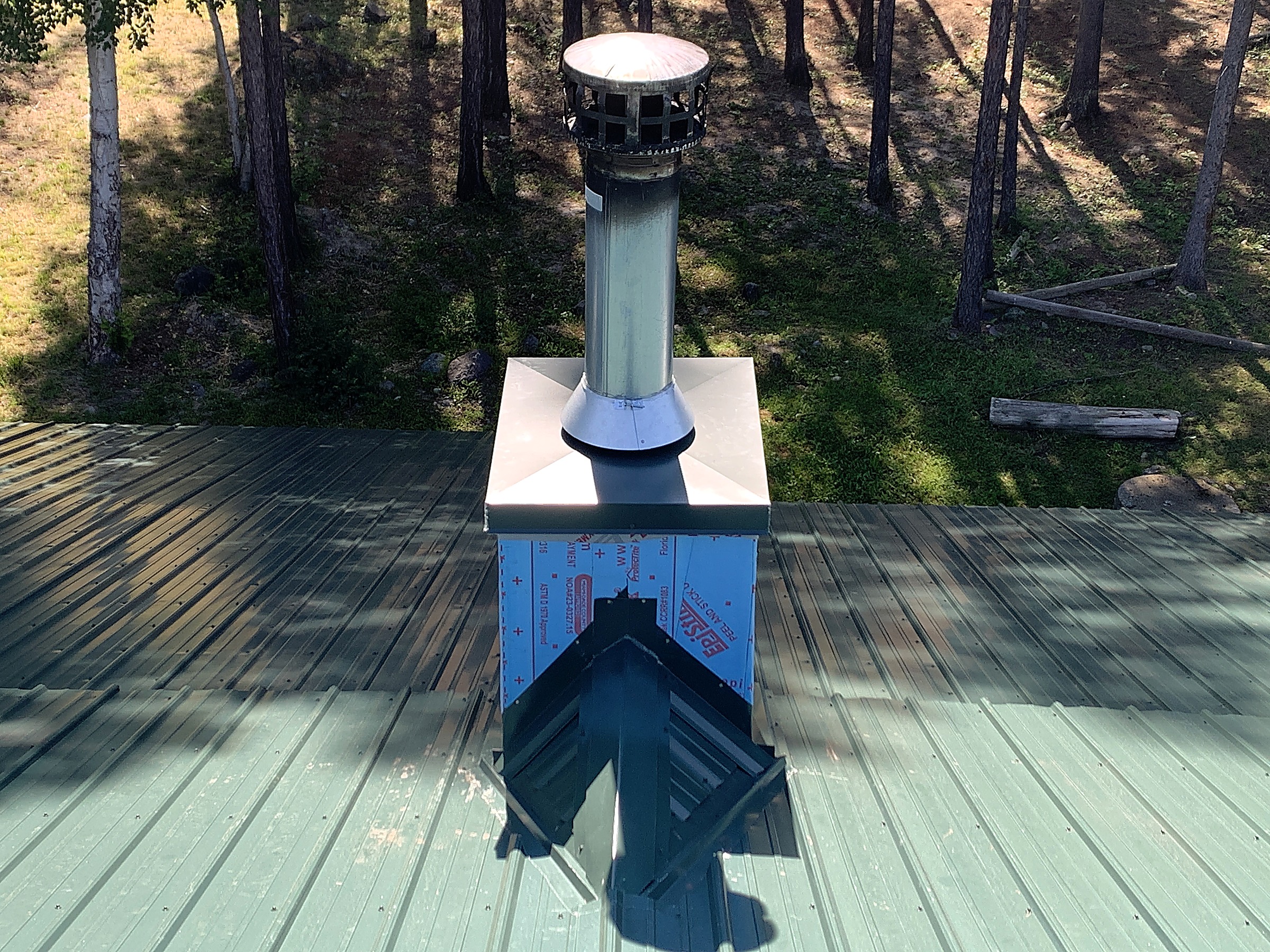 Vent flashing detail on a green metal roof, Flathead Valley, Montana