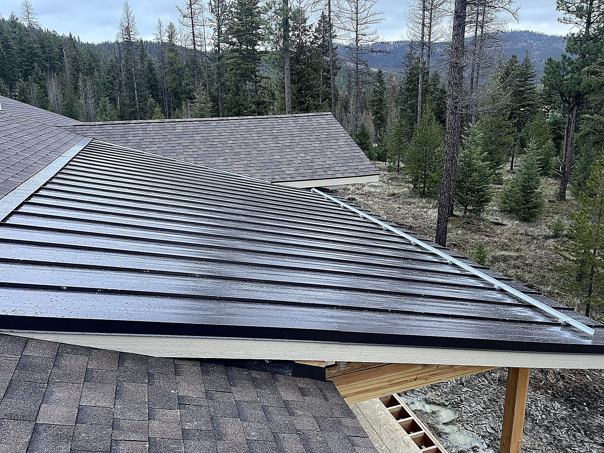 Snow retention rail installed on a metal roof in the Flathead Valley, Montana