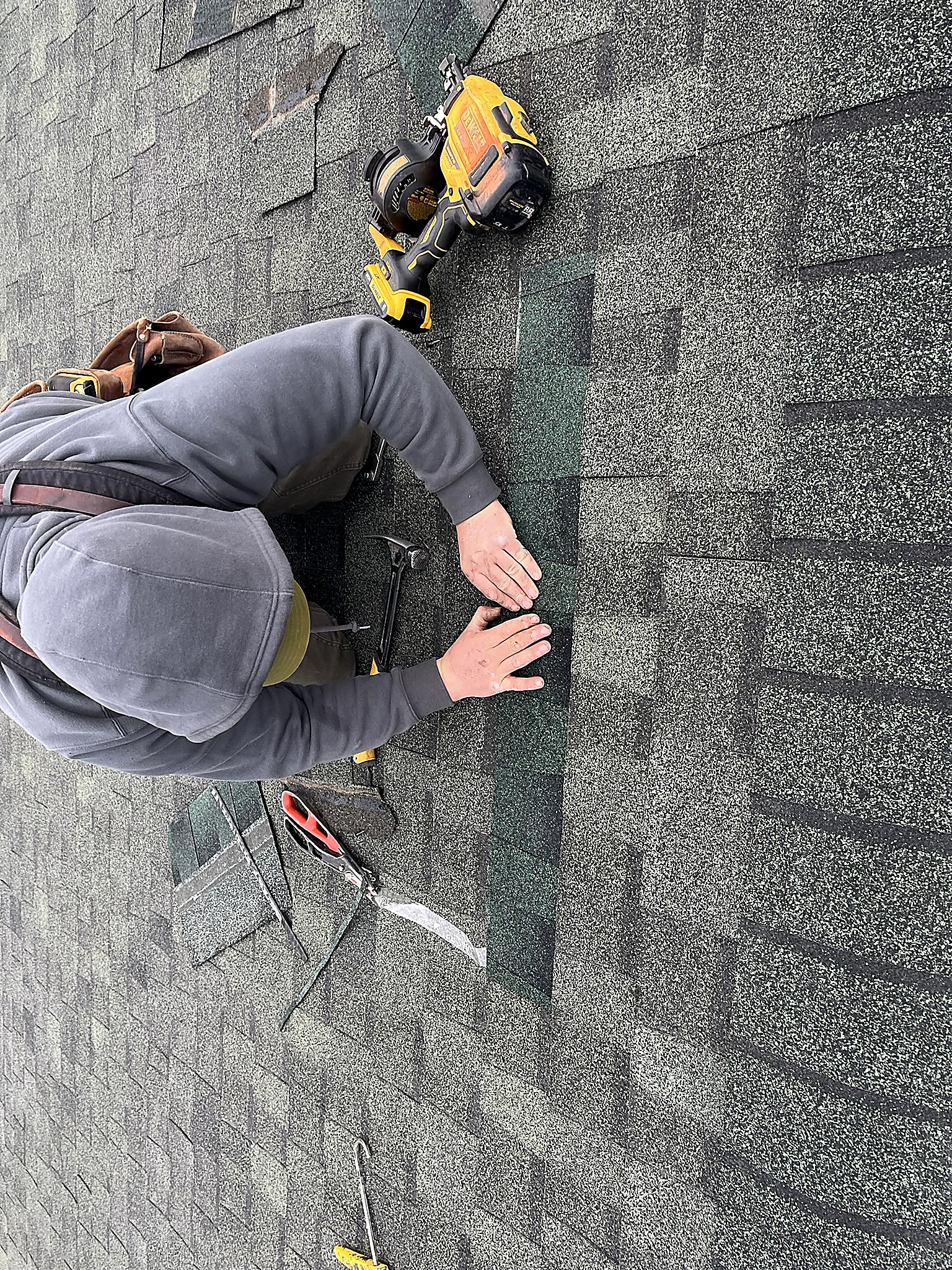 Flathead Valley Roofing crew member installing asphalt shingles in Northwest Montana