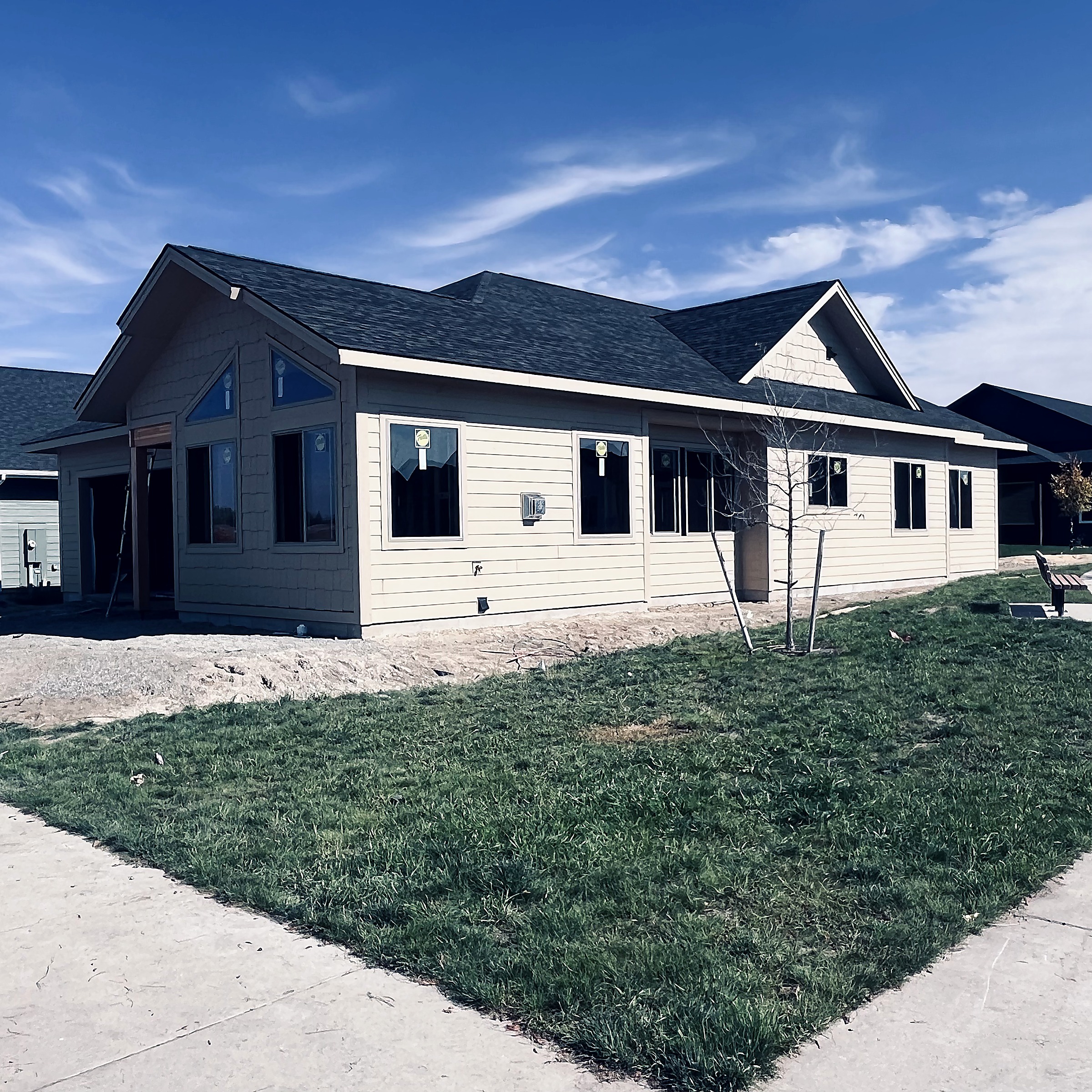 Completed asphalt shingle roof on a finished home in the Flathead Valley, Montana