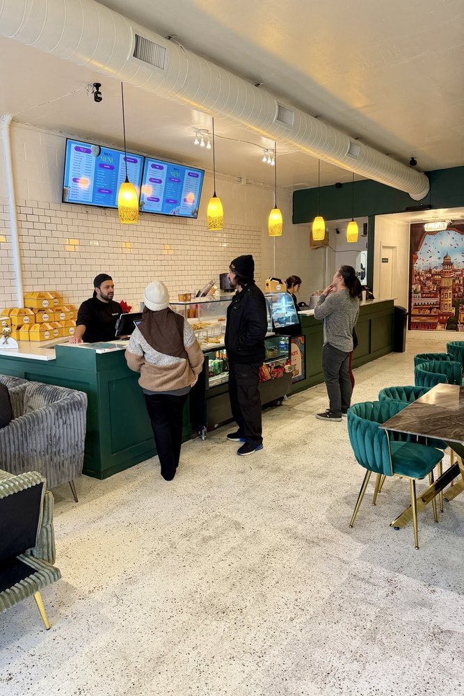 Chai & Co. counter ordering area and smiling barista