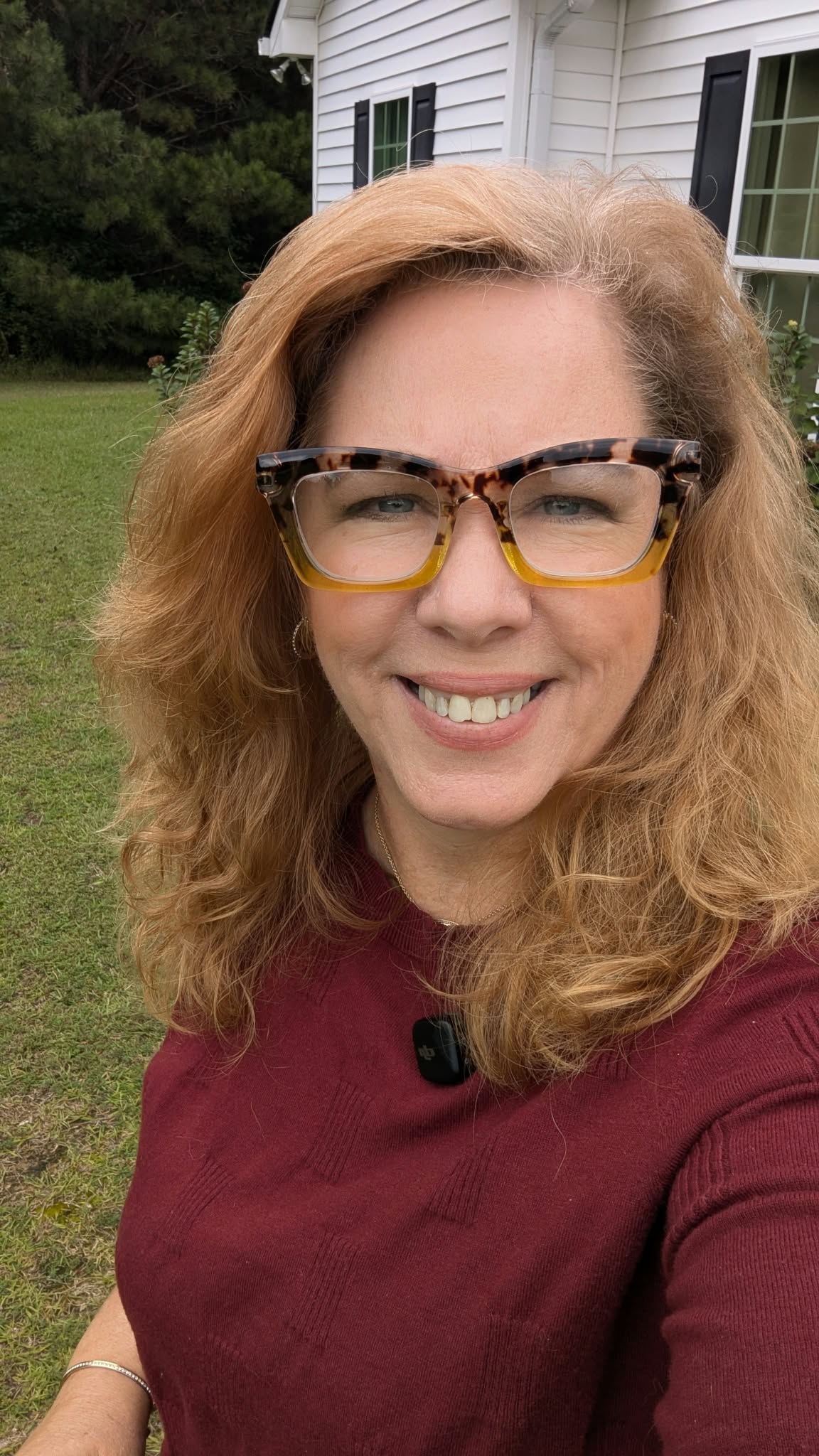 Teresa McKelvey outdoors in a burgundy sweater