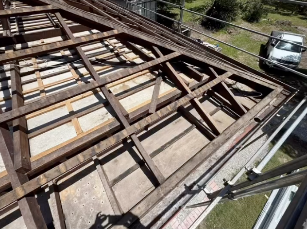 How is asbestos safely removed from a home?