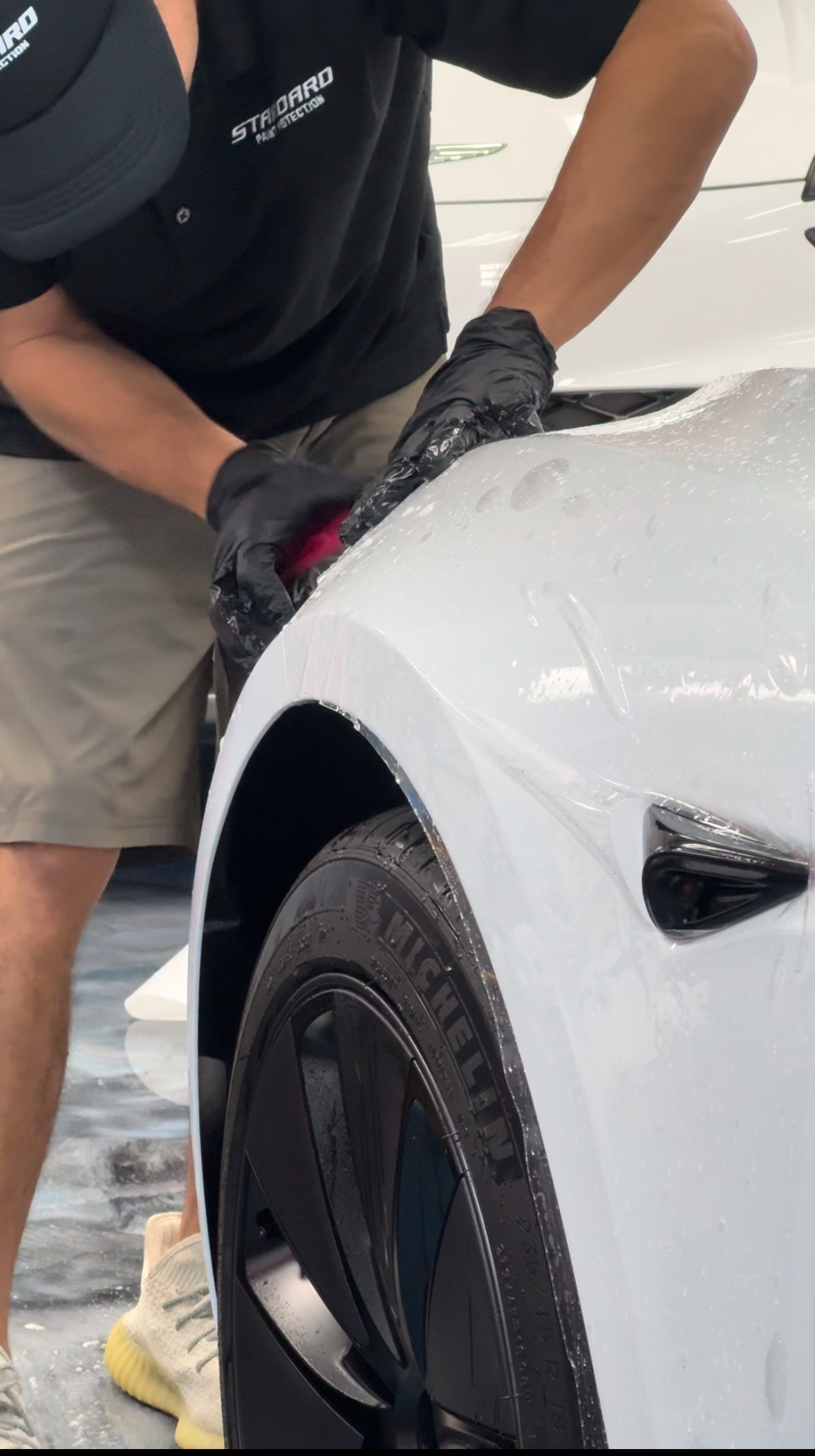Detail squeegee and edge alignment work on a vehicle panel