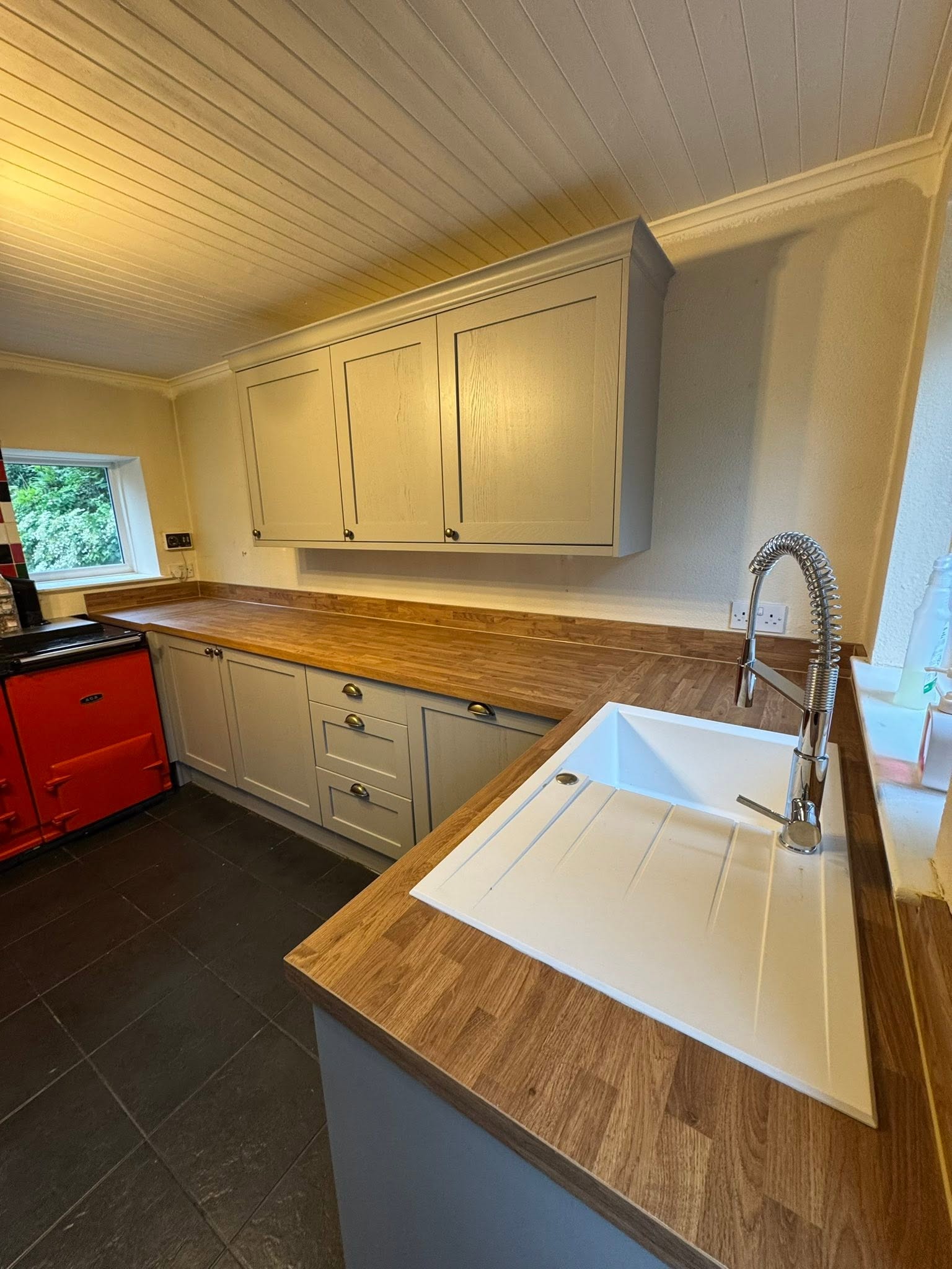 Full fitted kitchen renovation with oak worktops and shaker cabinets by MMA All Trades Dundee