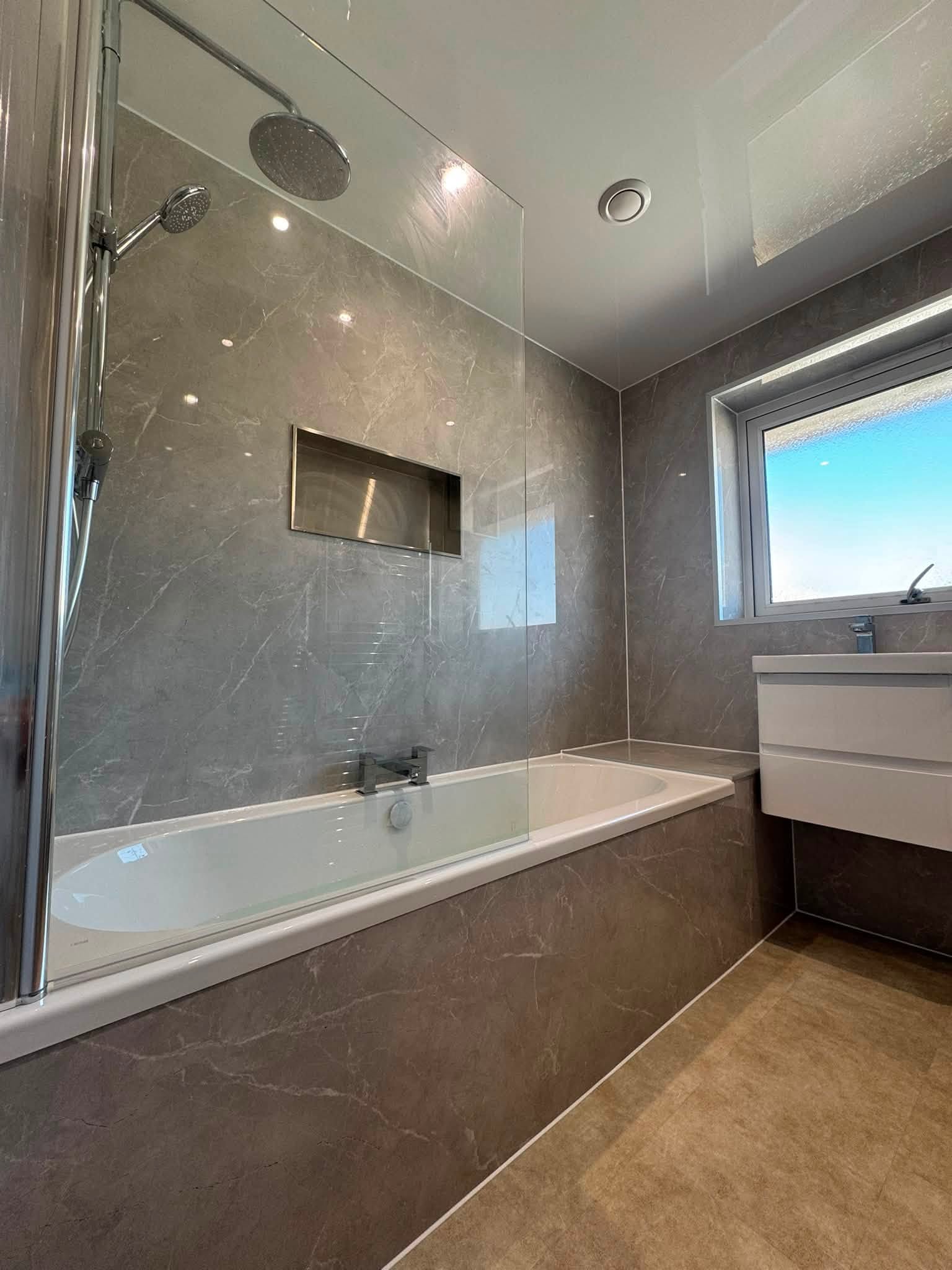 Luxury grey marble bath and shower installation with recessed niche by MMA All Trades Dundee