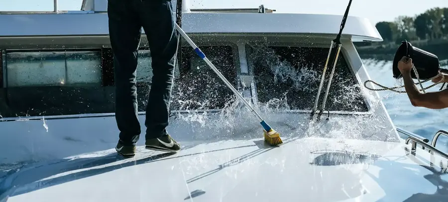Technician performing top-side care on vessel