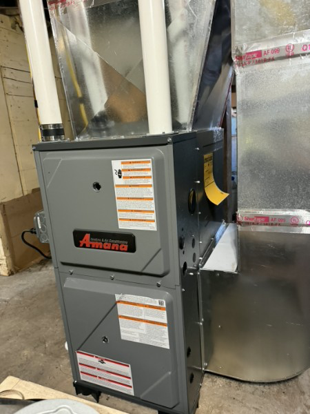 Amana furnace and custom-fabricated sheet metal transition