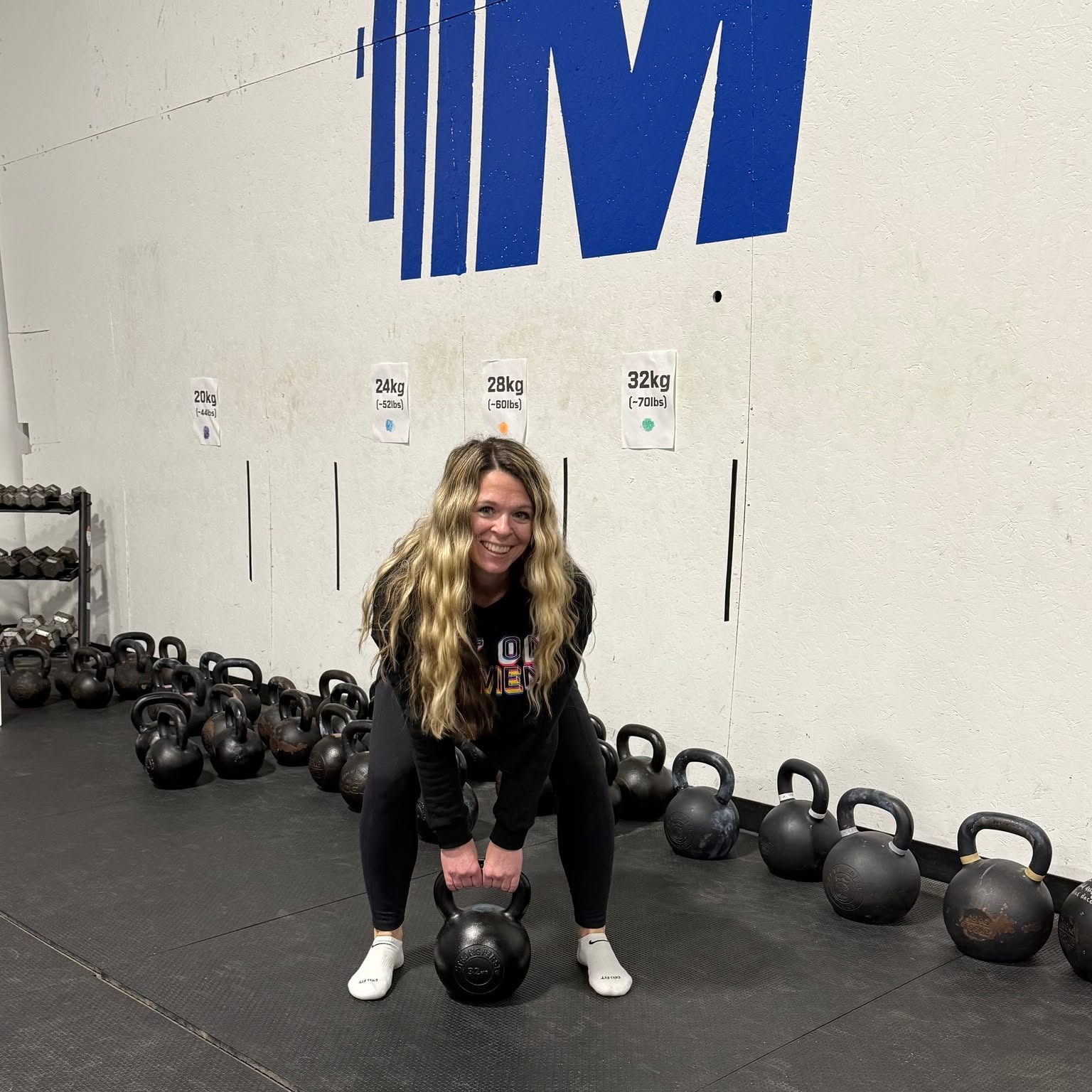 Inside Momentum Gym facility with clean kettlebells and weights