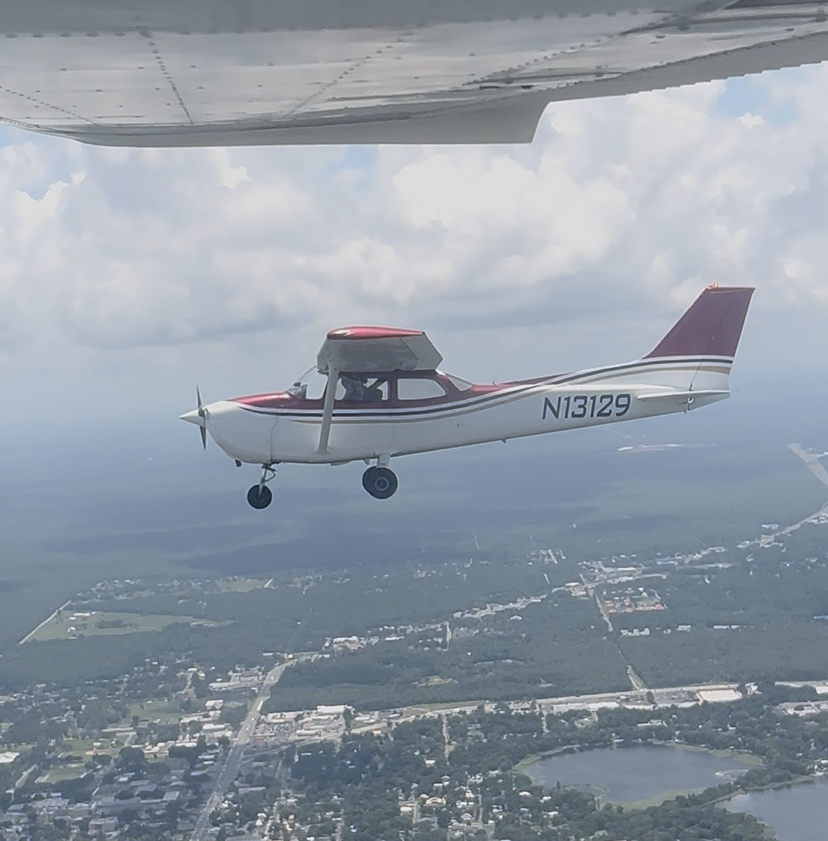 Legends Aviation primary IFR trainer Cessna 172 Skyhawk (N13129) flying in formation over Lakeland