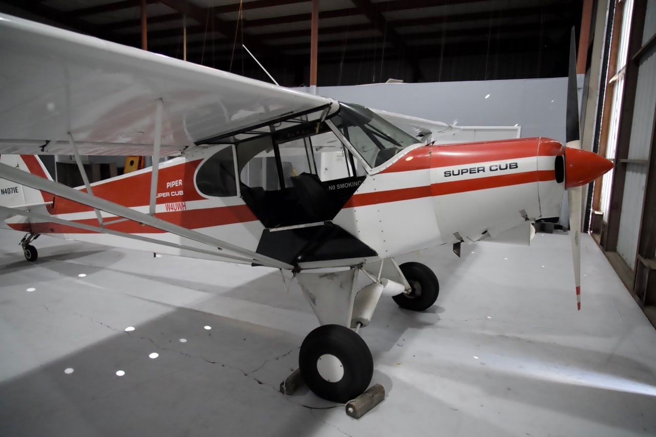 Legends Aviation Piper Super Cub N4071E with classic red and white livery in our Lakeland hangar