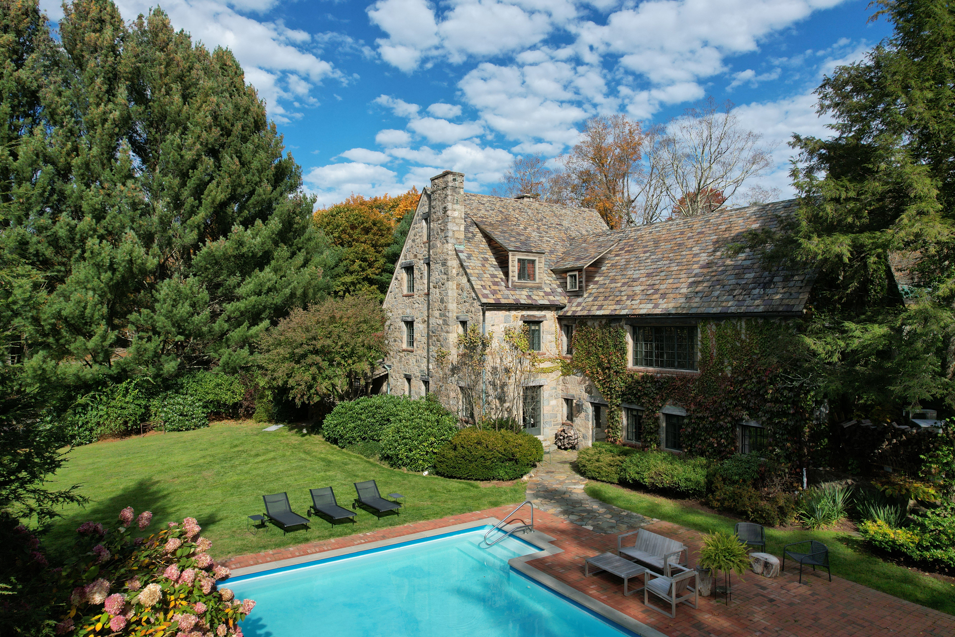 Saltwater swimming pool and stone architecture at Argyll House
