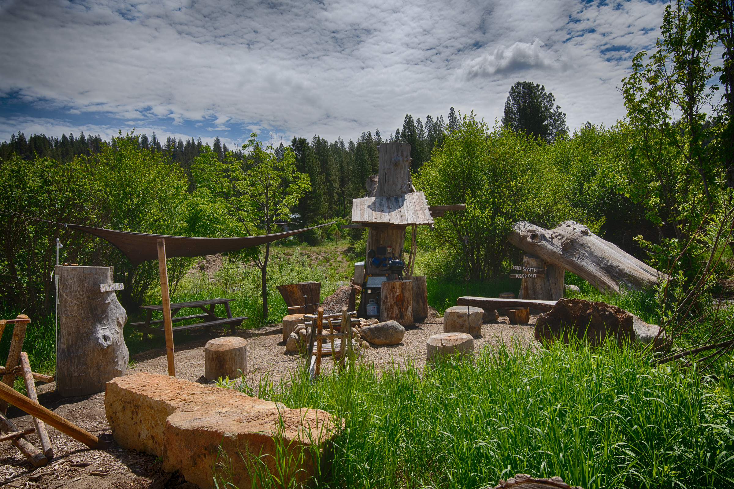 Canvas teepee and fire pit beside the Middle Fork of the Payette River in Garden Valley, Idaho