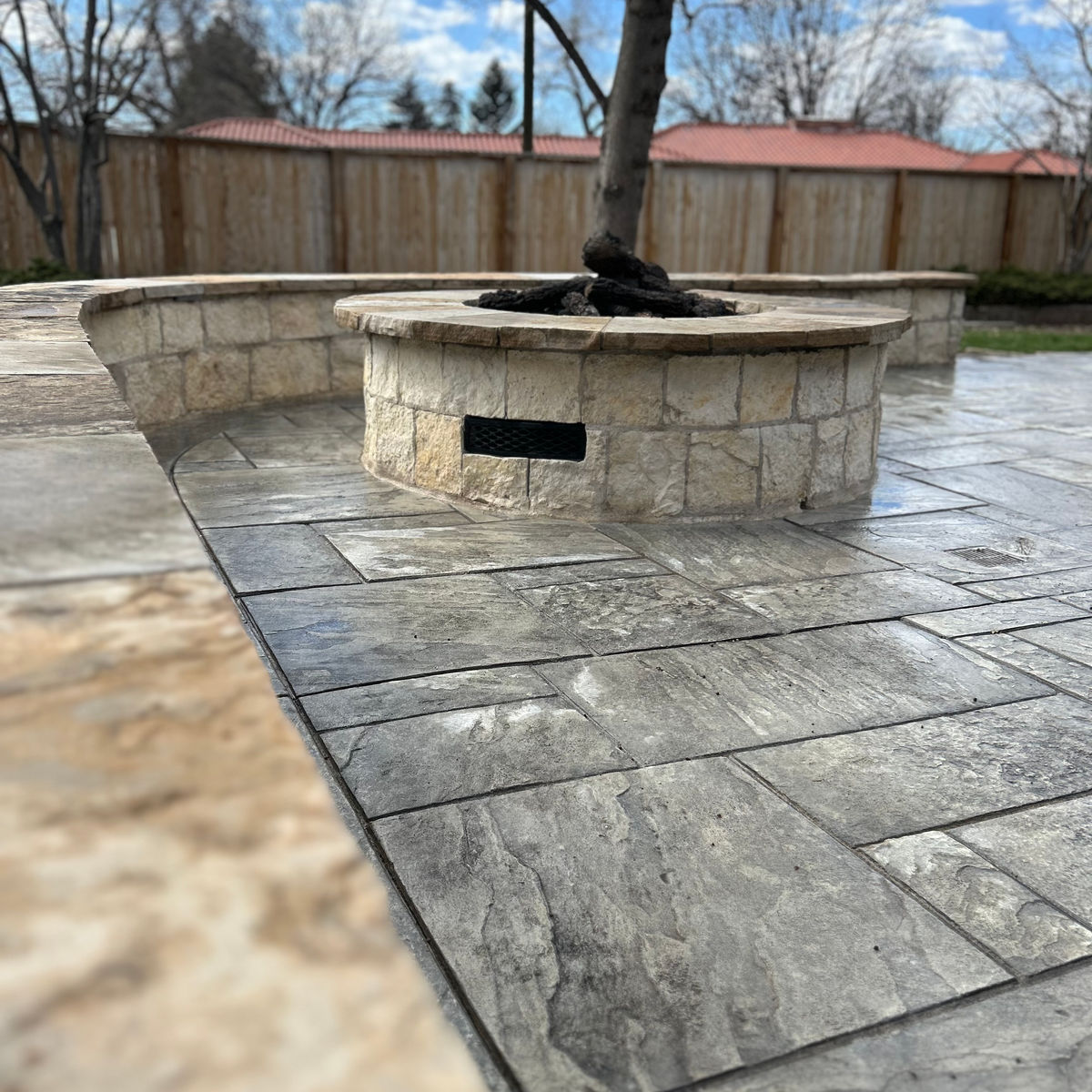 Walk-in stone shower with bench
