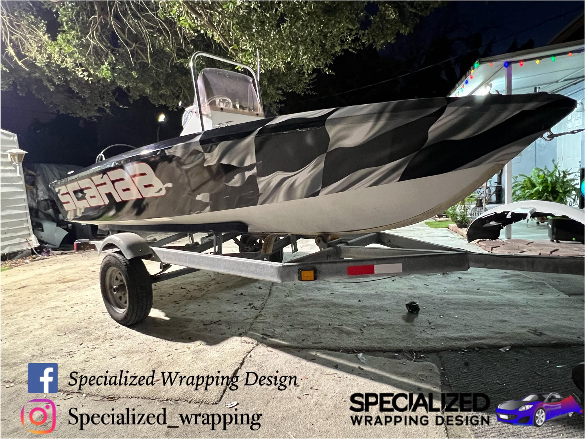 Custom Scarab speedboat high-performance checkered racing flag marine vinyl wrap in Miami FL