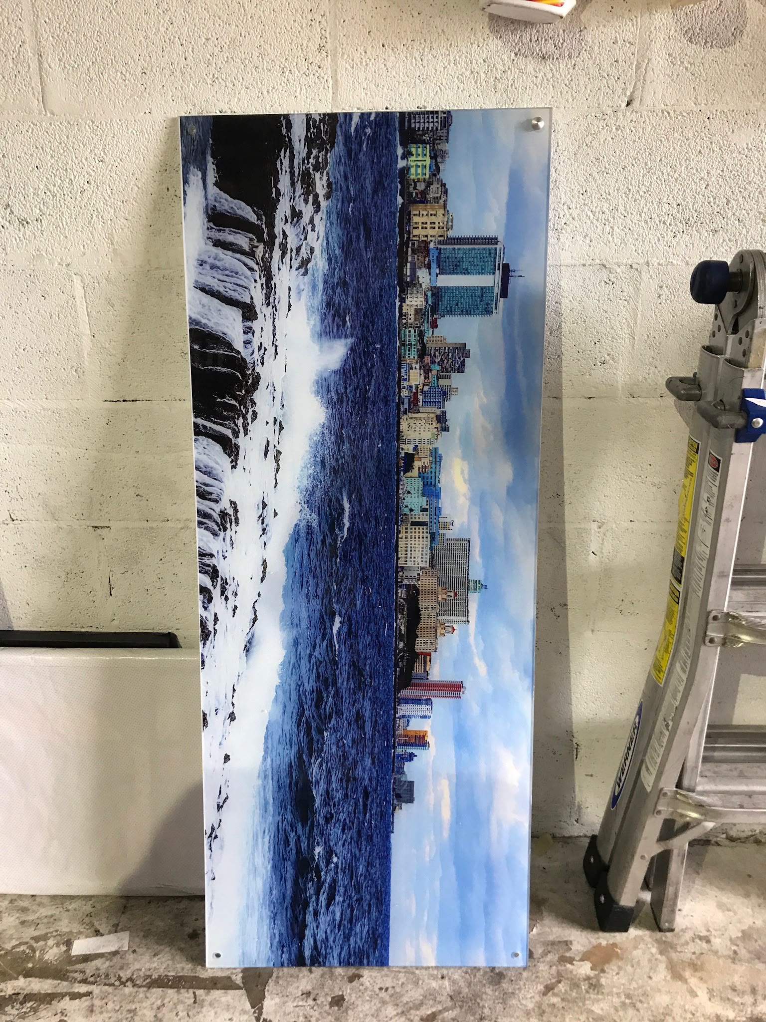 Custom vertical high-gloss acrylic photographic wall panel with stainless standoff mounting by Specialized Wrapping Design