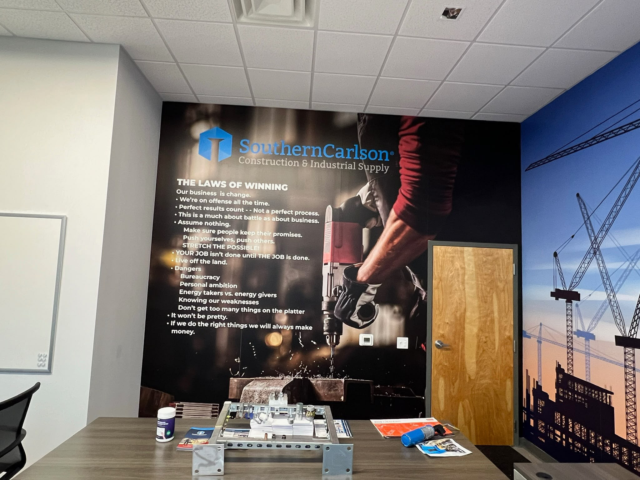SouthernCarlson Construction & Industrial Supply conference room feature wall wrap with corporate values in Doral FL