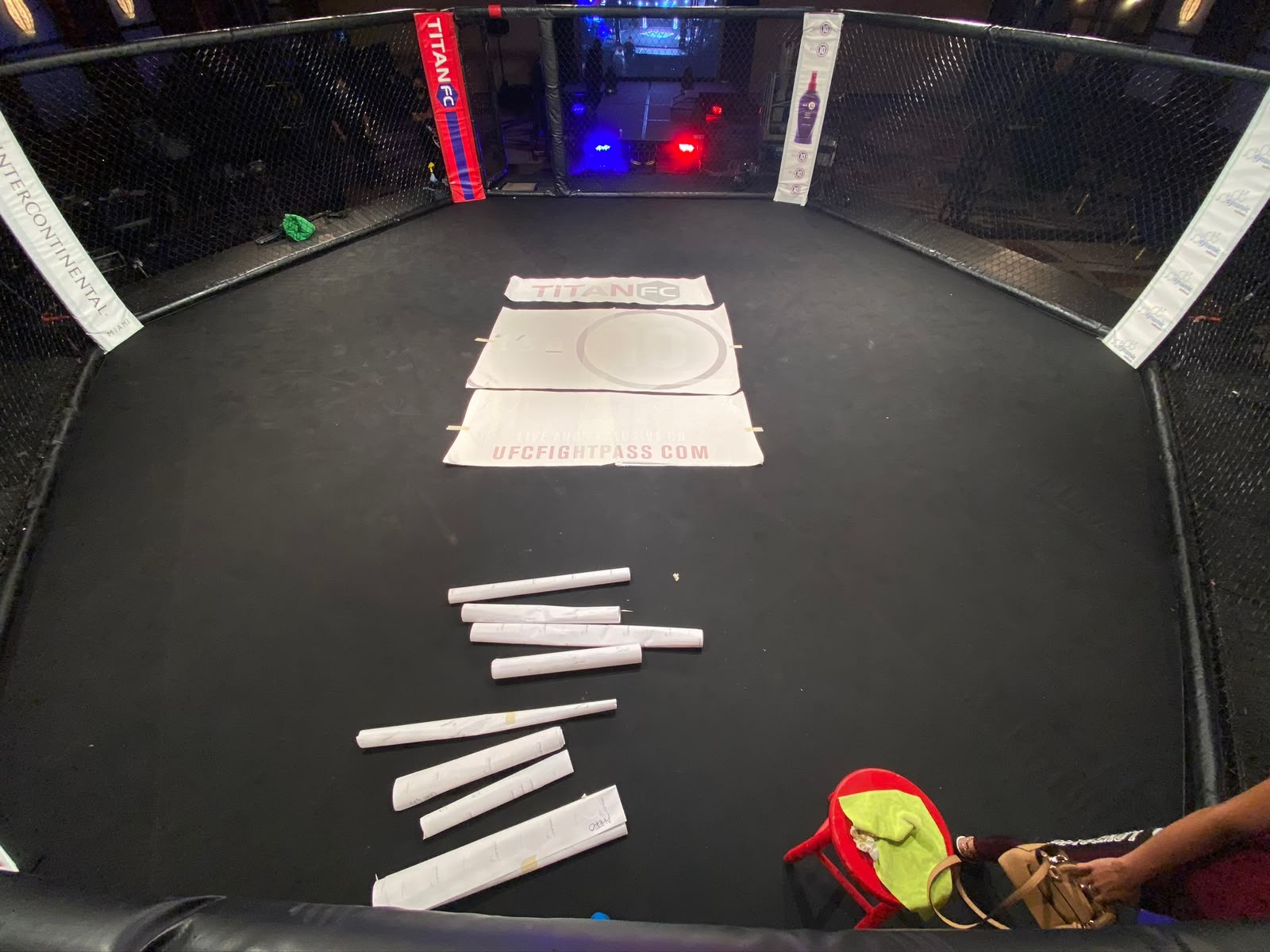 Precision layout and staging of Titan FC MMA canvas floor graphics and sponsor decals by Specialized Wrapping Design