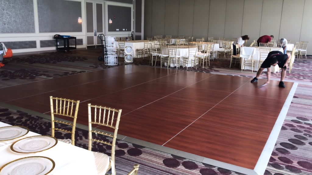 Mahogany wood grain ballroom dance floor wrap installation in Miami Beach FL by Specialized Wrapping Design