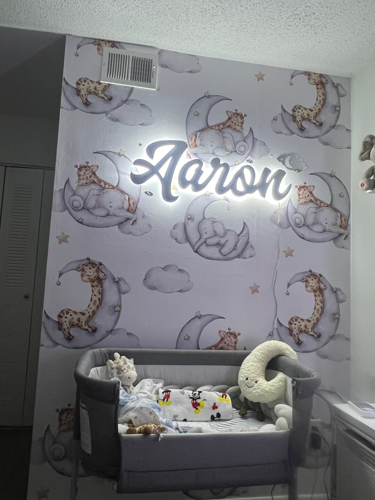 Custom baby nursery illustration wallpaper wrap and LED illuminated script name sign in Kendall FL