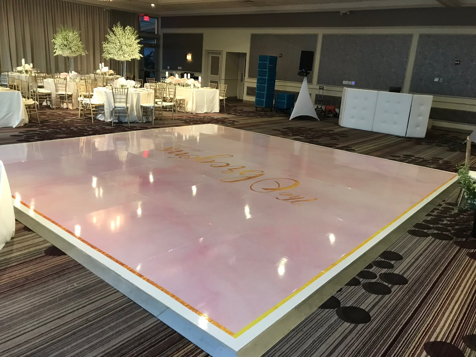 Custom blush pink marble and gold monogram dance floor wrap in Coral Gables FL
