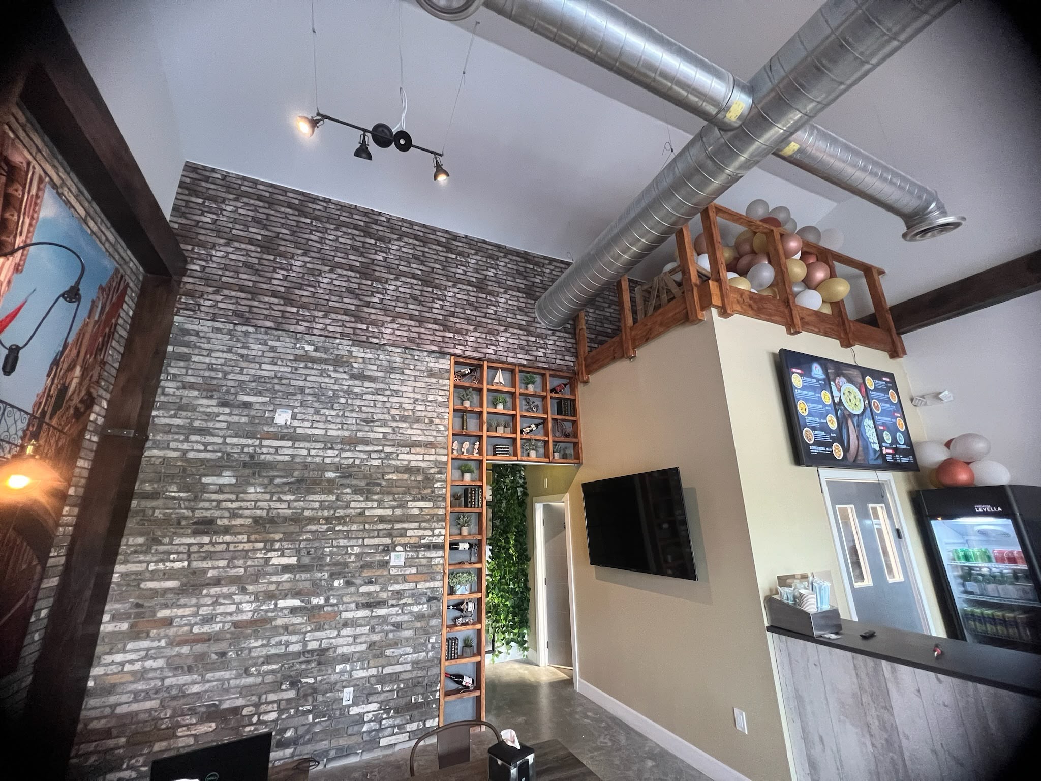 Commercial cafe and restaurant high-ceiling rustic distressed brick architectural wall wrap installation in Doral FL