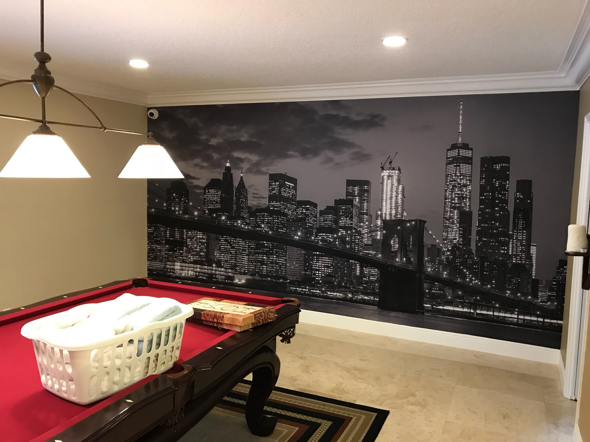 Luxury billiards game room monochrome New York City night skyline and Brooklyn Bridge panoramic wall mural wrap in Coral Gables FL