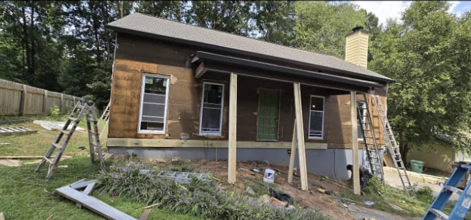 Front porch beam framing, window replacement prep, and exterior wall rebuild by Quality Painting & Home Repairs in Dallas GA